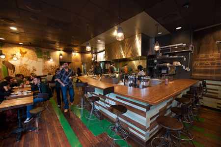 The interior of Glaze is outfitted with reclaimed wood and the original wooden floors.
