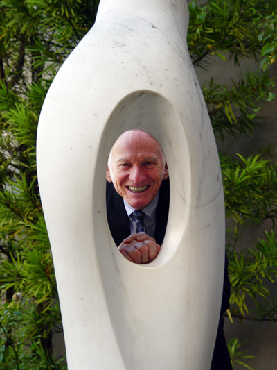 Ever-playful music man Alden Gilchrist with a sculpture by Ralph O'Neill