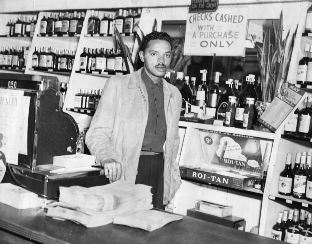 George Hall, Charles Sullivan's brother-in-law, inside the Post Street Liquor Store. Photograph courtesy of the Hall family.