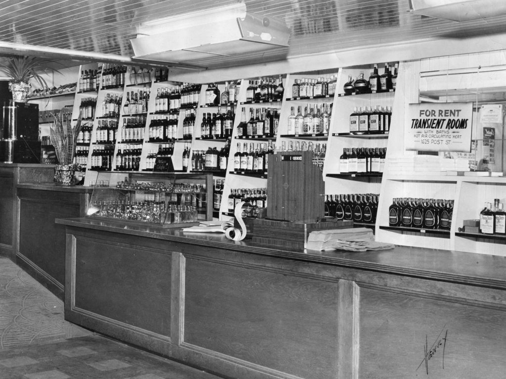Interior of Post Street Liquors. Sign advertises rooms for rent upstairs in the Sullivan Hotel. Photograph courtesy of the Hall family.