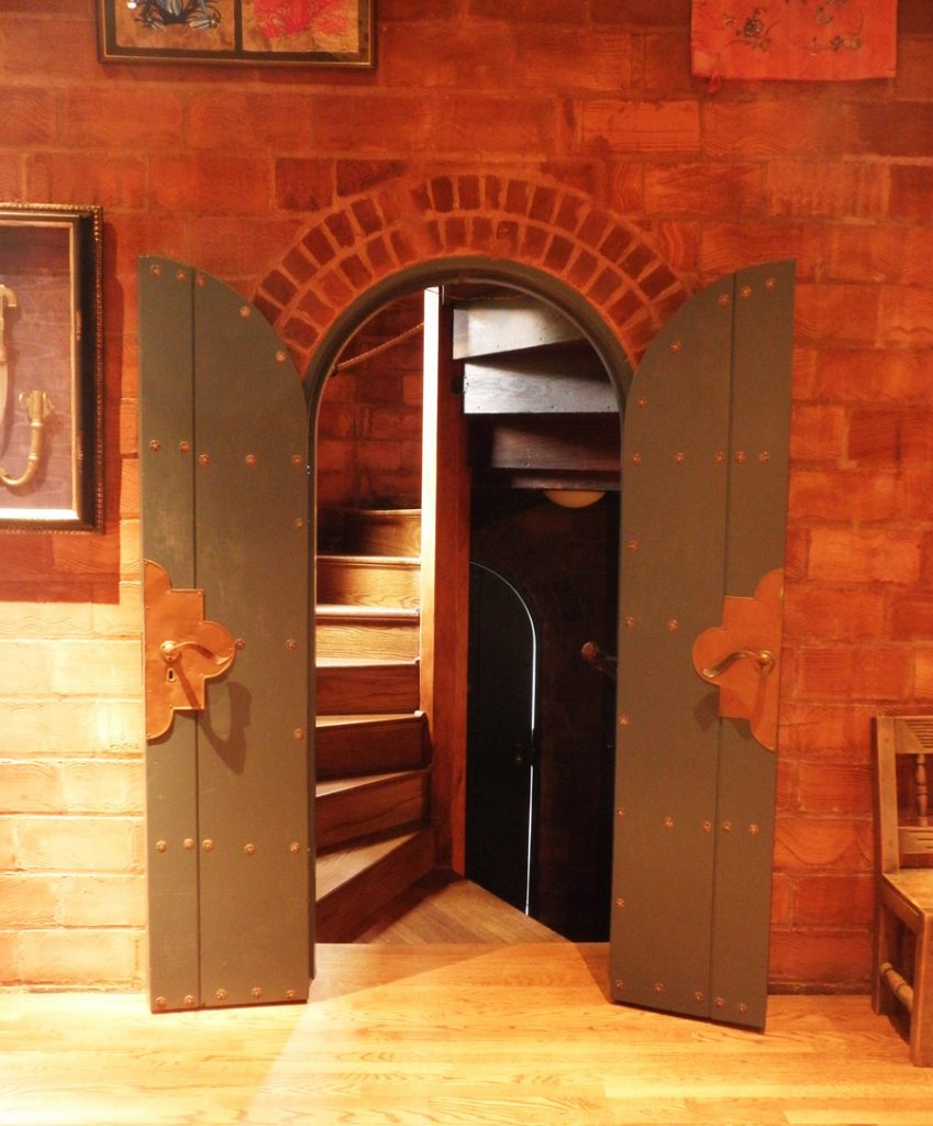 The doorway to the turret features copperwork by Digby Brooks.