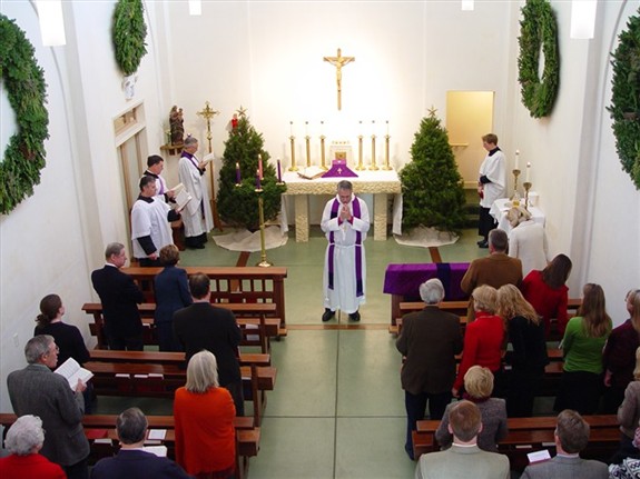 Archbishop James Provence celebrating mass at St. Thomas Church.