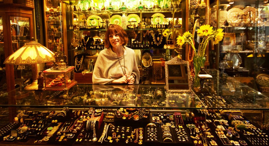 Adele Pomeroy shows antique jewelry at Mureta's Antiques.