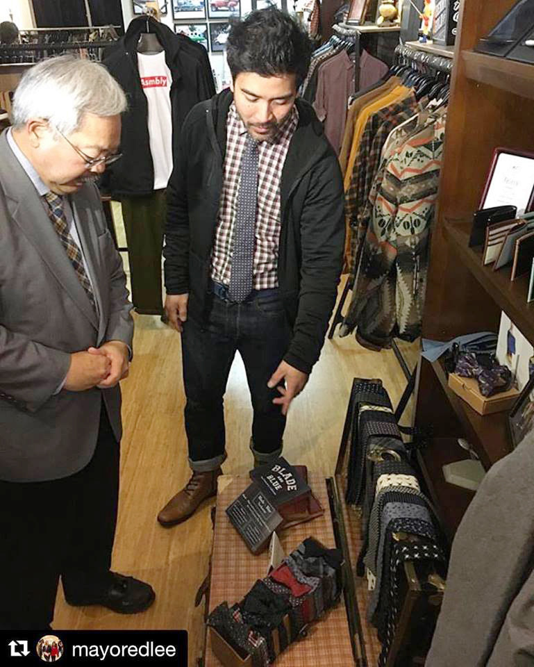 Asmbly Hall’s Ron Benitez (center) offers Mayor Ed Lee fashion advice