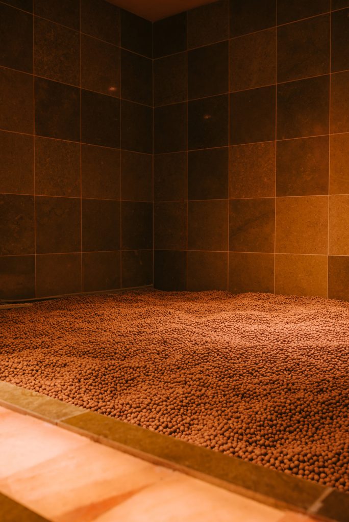 The Clay Room is filled with marble-sized balls of red clay.