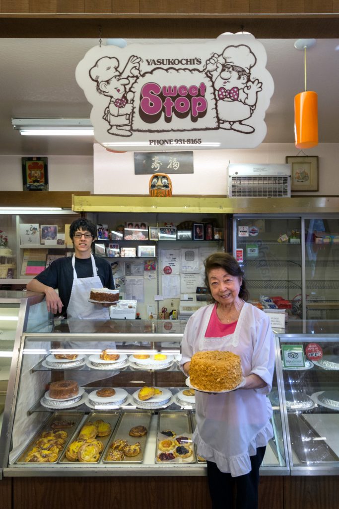 Sweet Stop co-owner Hatsy Yasukochi and her grandson Kenji Yick — and the legendary Coffee Crunch Cake.