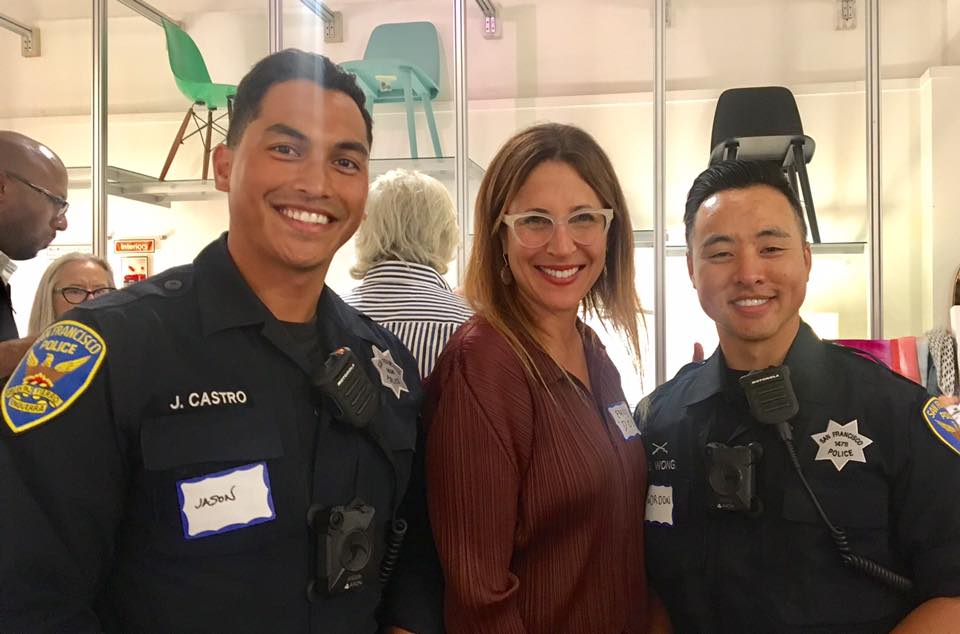 Officers Jason Castro (left) and Gordon Wong (right) with Dosa owner Emily Mitra.